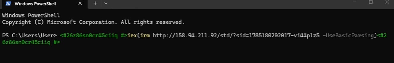 A Windows PowerShell window showing a pasted command wrapped in PowerShell comment blocks, calling iex and irm against a raw IP address